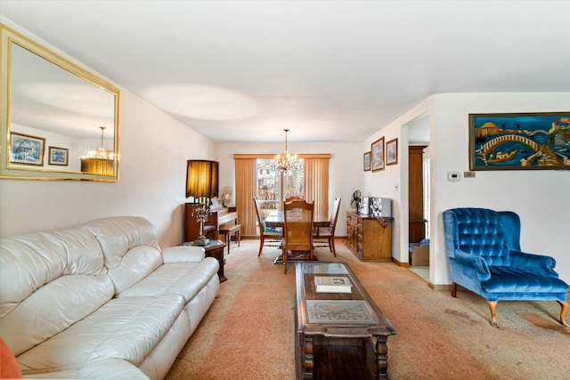 living room with an inviting chandelier and carpet floors