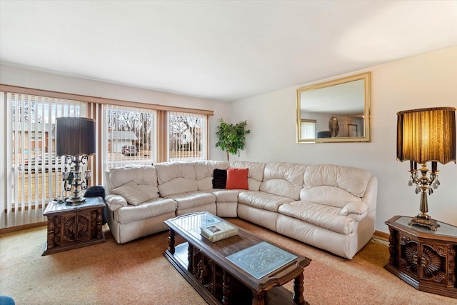 living room with plenty of natural light and carpet floors