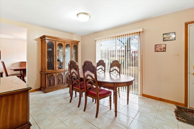 dining room featuring light tile patterned flooring