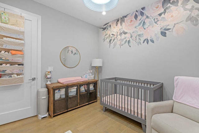 bedroom with light hardwood / wood-style floors