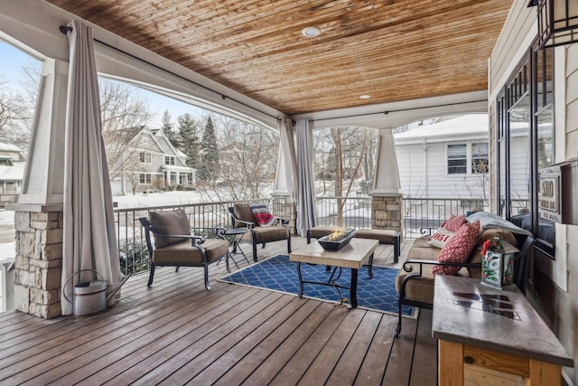 snow covered deck with outdoor lounge area