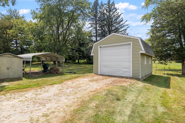 garage with a lawn and a carport