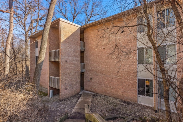 view of home's exterior featuring brick siding