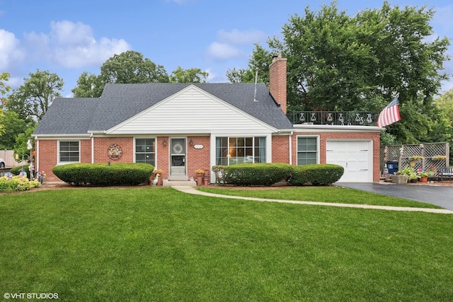 view of front of property with a garage and a front yard