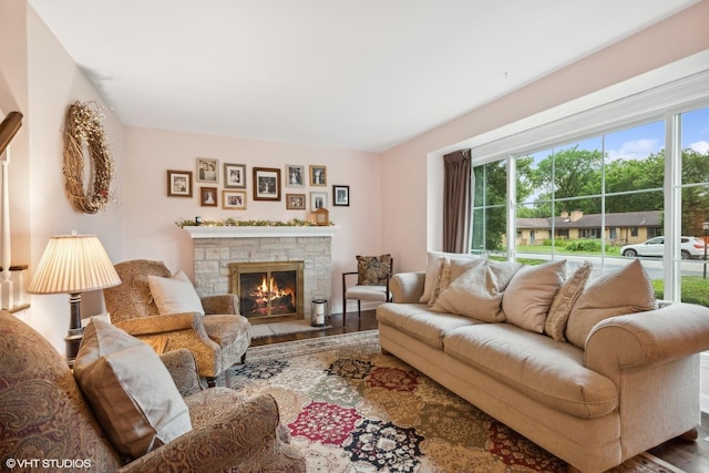 living room with hardwood / wood-style floors and a fireplace