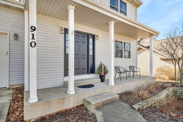 doorway to property featuring covered porch