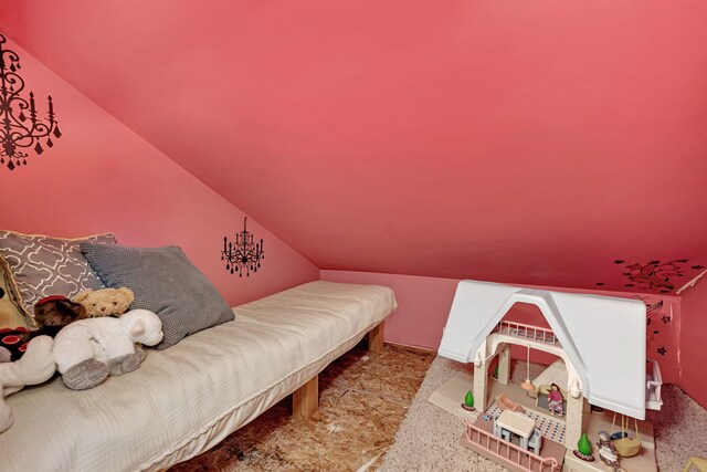 bedroom with light colored carpet and a closet