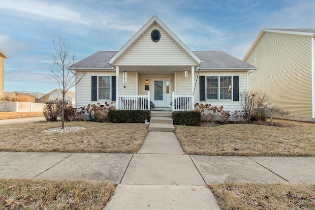 view of front facade featuring a front yard and a porch