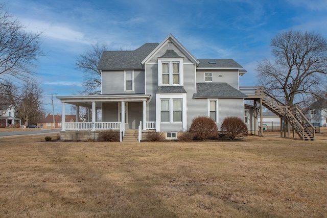 view of front of home featuring a front lawn and covered porch