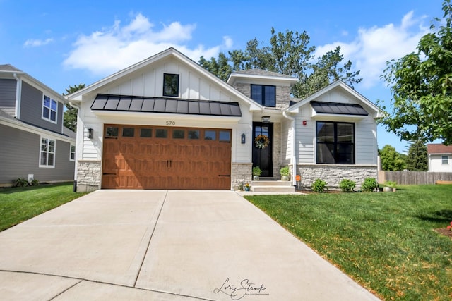 view of front of house featuring a front yard and a garage