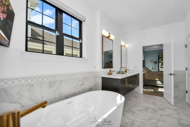 bathroom with vanity and a bathing tub