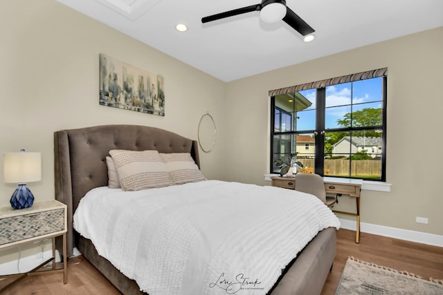 bedroom featuring ceiling fan and light hardwood / wood-style flooring