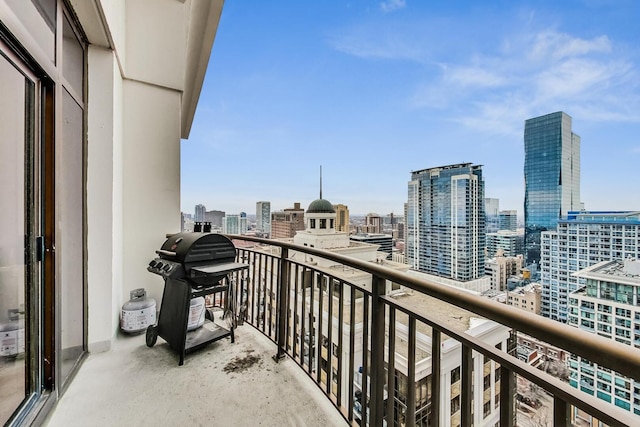 balcony with grilling area and a city view