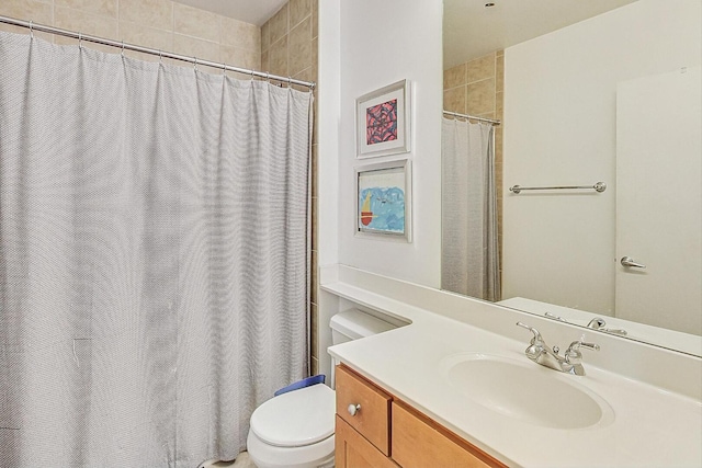 bathroom featuring a shower with curtain, vanity, and toilet