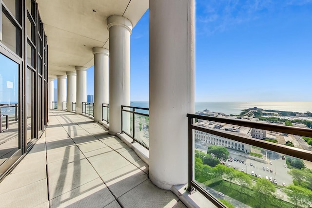 balcony with a water view and a city view