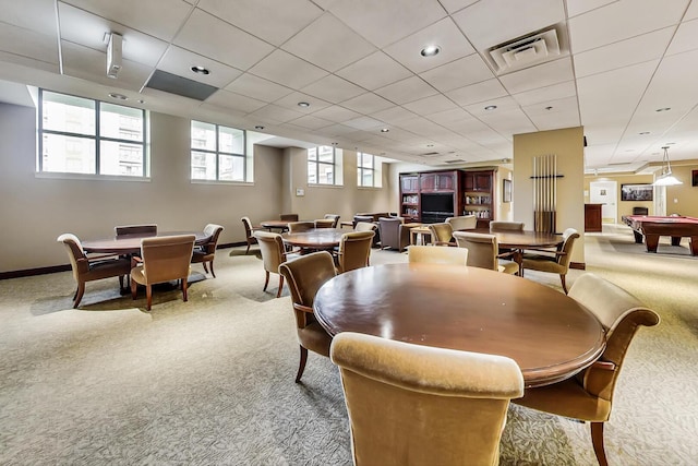 carpeted dining area featuring baseboards, visible vents, a drop ceiling, and pool table