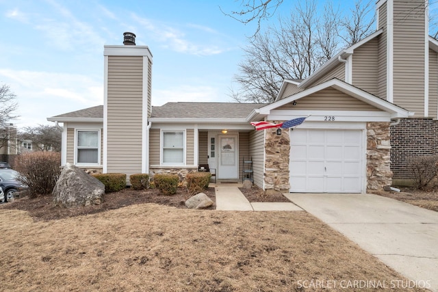 view of front of home with a garage and a front yard