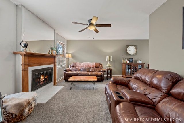 carpeted living room with ceiling fan