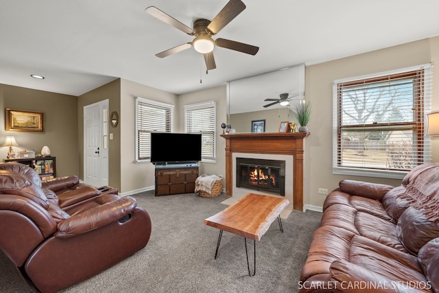 carpeted living room featuring a healthy amount of sunlight and ceiling fan