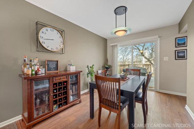 dining space with light wood-type flooring