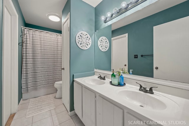 bathroom featuring walk in shower, vanity, tile patterned floors, and toilet