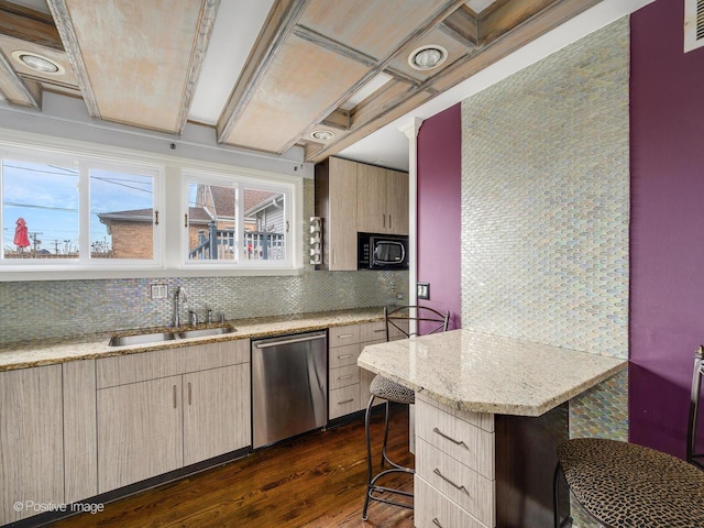 kitchen with a breakfast bar, dark hardwood / wood-style floors, sink, stainless steel dishwasher, and light stone countertops