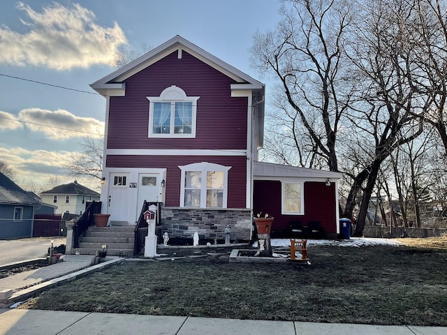 front facade with a front lawn