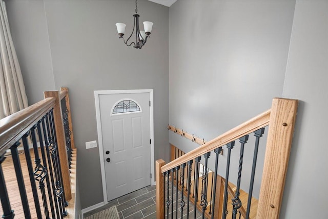 foyer entrance with an inviting chandelier