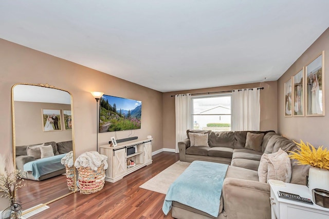 living room with dark hardwood / wood-style floors