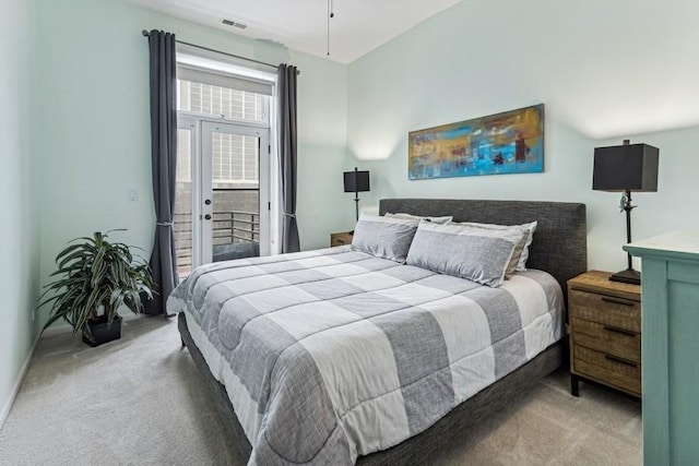 bedroom with carpet floors, access to exterior, and visible vents