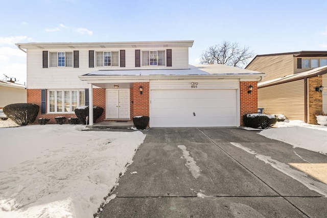 front of property with a garage