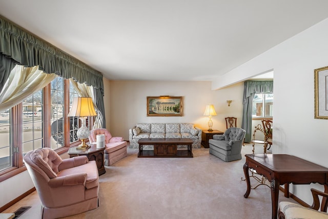 carpeted living room featuring a healthy amount of sunlight