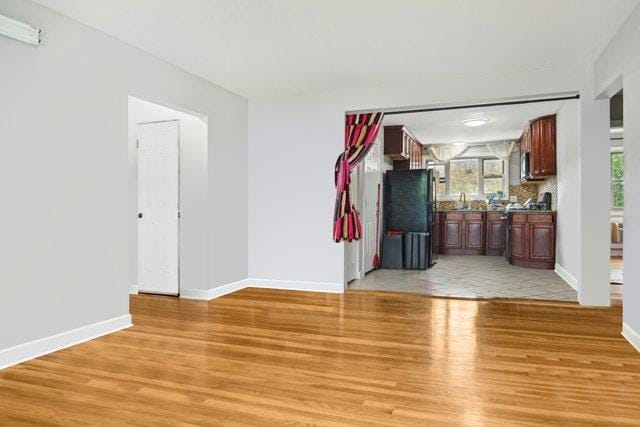 spare room featuring light hardwood / wood-style floors