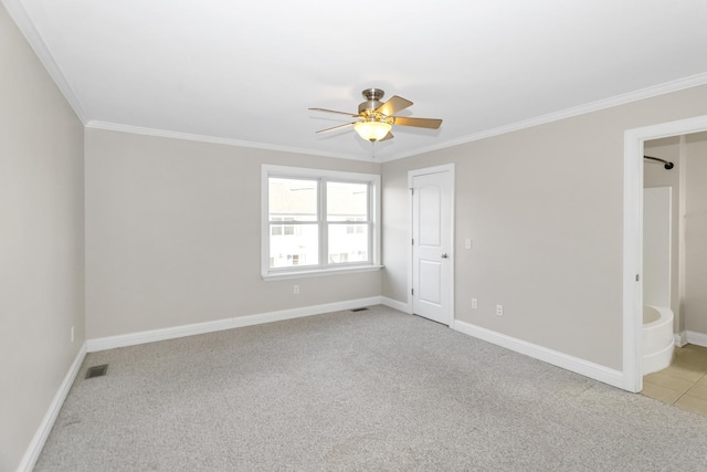 unfurnished room featuring light carpet, baseboards, visible vents, and crown molding