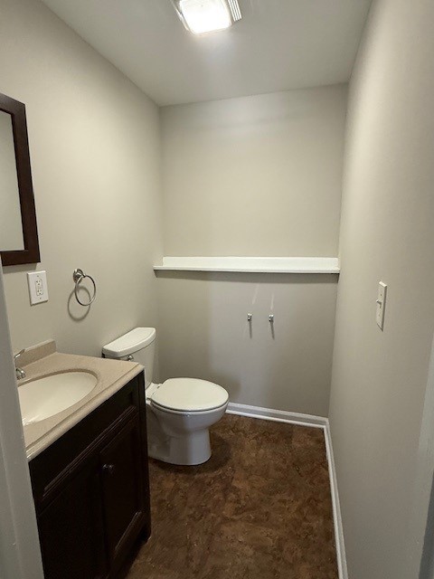 bathroom featuring vanity and toilet