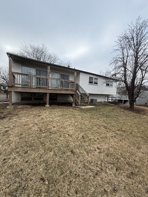 back of house with a yard and a deck