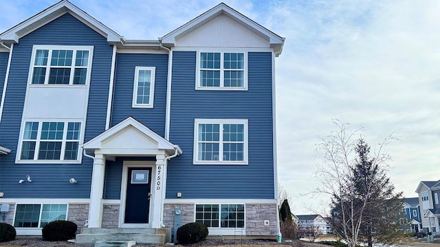 view of front of home with stone siding