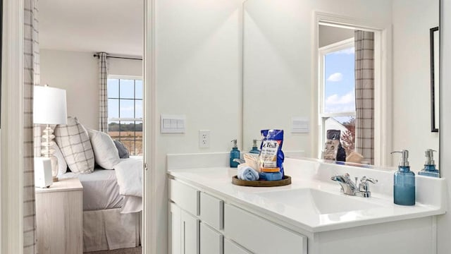 ensuite bathroom featuring ensuite bath and vanity