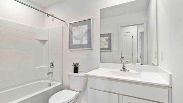 bathroom featuring toilet, shower / bathing tub combination, and vanity