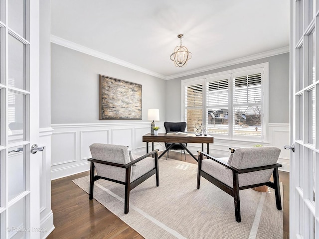 office with ornamental molding, a notable chandelier, and wood finished floors