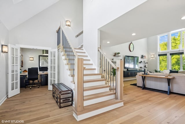37580 N Fairfield Rd, Lake Villa, IL 60046 - stairs featuring high vaulted ceiling, french doors, wood finished floors, and recessed lighting
