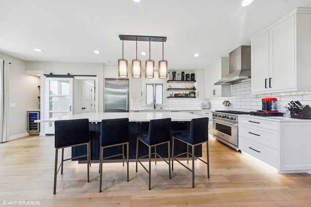 37580 N Fairfield Rd, Lake Villa, IL 60046 - kitchen with premium appliances, wall chimney range hood, open shelves, light countertops, and beverage cooler