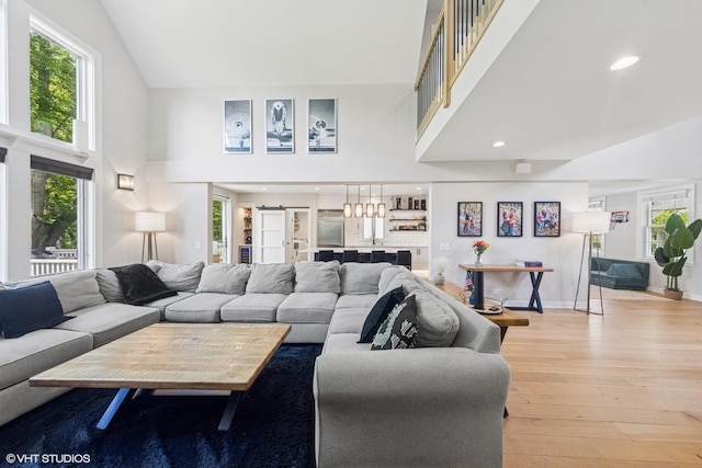 37580 N Fairfield Rd, Lake Villa, IL 60046 - living room with high vaulted ceiling, light wood-style floors, plenty of natural light, baseboards, and recessed lighting