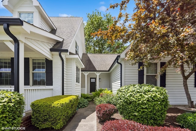 37580 N Fairfield Rd, Lake Villa, IL 60046 - view of side of property with a shingled roof and covered porch