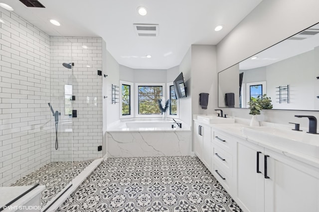 37580 N Fairfield Rd, Lake Villa, IL 60046 - bathroom with a bath, a stall shower, double vanity, recessed lighting, and tile patterned flooring