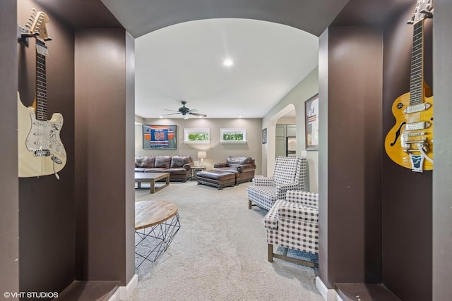 37580 N Fairfield Rd, Lake Villa, IL 60046 - living room featuring arched walkways, carpet, and a ceiling fan