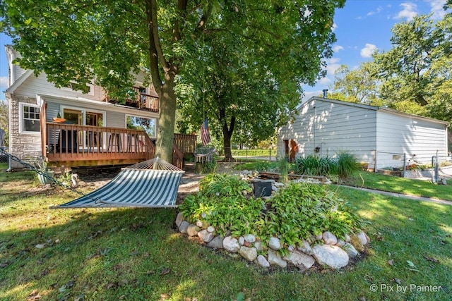 view of yard with fence and a deck