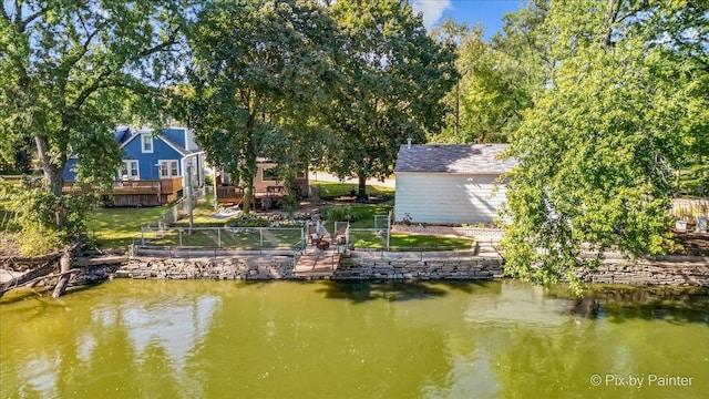 dock area with a water view and fence