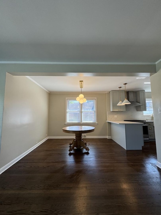 unfurnished dining area with crown molding and dark hardwood / wood-style flooring