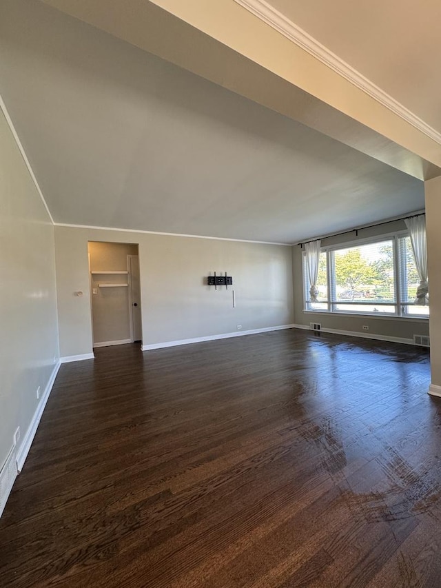 unfurnished living room with dark wood-type flooring